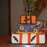 Halloween Birthday Cake This was my first attempt at fondant. I had a hard time keeping the BC smooth. Seemed like every time I put on a piece of fondant the BC...