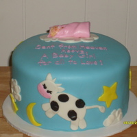 Cow Jumped Over The Moon 2 layer totally covered in fondant. This was my first attempt at covering a cake with fondant.