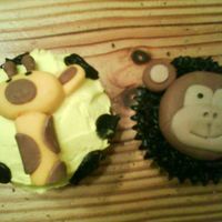 Jungle Fun! Jungle theme I did for baby shower. Animals made with MMF. First real attempt with fondant figures. Choc and Yellow cuccakes with...