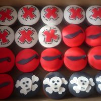 Pirate Cupcakes I had fun with these. Pirate themed chocolate peanut butter cupcakes. Fondant cut outs.