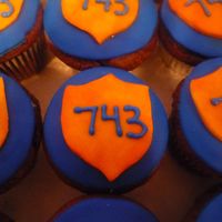 Officer Badge Cupcakes for an officer. All fondant. The 743 is his badge number.