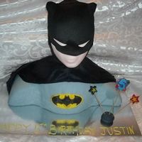3D Batman/bust Cake This was for my son's 5th birthday. 2 10" chocolate and 1 8" white for the body. The head is a wig head covered in fondant....