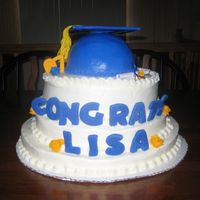 Grad Cake this was done for my cousins graduation party. all three teirs were white cake frosted with buttercream as well as the cap. the lettering...