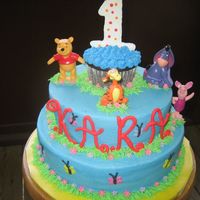 Img_0016_2.jpg MY NEICES IST BIRTHDAY CAKE ALL BUTTERCREAM POOH AND FRIENDS ARE TOYS AND THE NUMBER ONE ON TOP IS ROYAL IING AS WELL AS HER NAME.SO FUN...