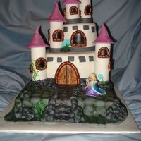 Castle Cake Made this for my neice's 5th Birthday. The bottom rocky layer is chocolate, the top two are pound cake. Covered in fondant. Made the...