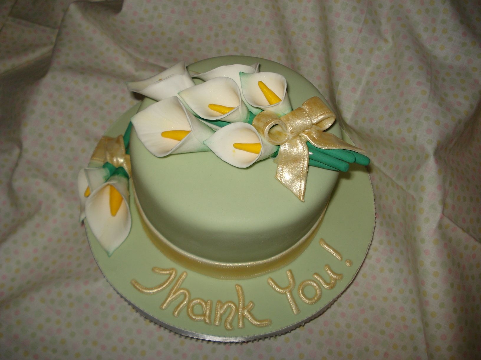 Calla Lily "thank You!" Cake This is a 6" round caramel cake with bavarian cream filling. It is covered with Michelle Foster's Fondant. Calla Lilies are made...
