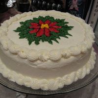 Poinsettia Cake I did this poinsettia freehand. I outlined it in black, and then filled it in with red. It is a red velvet cake with vanilla buttercream