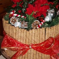 Chocolate Christmas Cake This is a chocolate cake, torted and filled with chocolate buttercream, iced in buttercream, with cookies around the sides (why can I not...