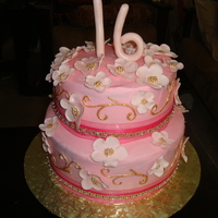 Sweet 16 Cake Cake for a sweet 16- pink and gold accents- chocolate cake and chocolate fudge filling, pink butter cream and gold royal icing accents.