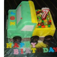 Joe's Truck This is Joe's birthday cake, mandarin cake cover with fondant. Chocolate and candy at the back