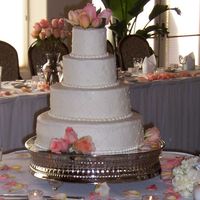 In Memory Of Kathy Wedding cake for friend's wedding, july 2006. Peach fresh roses (I prefer not to stick roses directly into cake, for the record) on a...