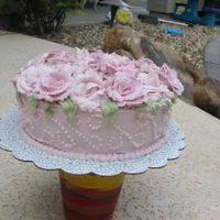 Roses Galore This cake was pictured on the cover of the Wilton Decorating Book. The top is covered with buttercream roses. The sides have Tip 3 dots in...