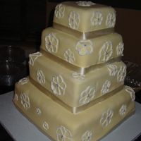 Square Wedding Cake This cake was a team effort. I did not do the final decoration (flowers). I wish I had because they were supposed to be daisies.