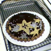 Twinkle Twinkle This is a flourless chocolate truffle cake with a chocolate ganache with simple chocolate method stars brushed with gold and silver luster...
