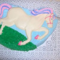 Unicorn Cake can I just say... WHAT a pain in the tooter! The unicorn itself is white chocolate morsels melted. I made it three times before succombing...