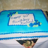 Birthday Cake This is 2 11x18 pans next to each other...1/2 is chocolate, the other 1/2 is yellow....First time i used fondant on a cake.. also first...