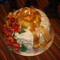 Classy Birthday This cake was for a friend for a work brithday function. The cake was a white cake with a strawberry filling and an ivory whipped icing....