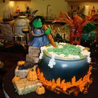 Witch's Brew This cake was for a friend whose kitchen was Witch Themed for a Halloween Party. The cake (the cauldron) was a lemon cake with an orange...