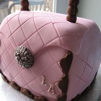 Pink Purse Cake White almond sour cream cake. Pink fondant, gumpaste handle. First attempt at a carved cake.