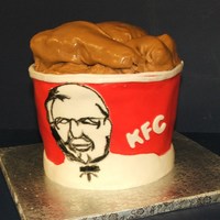 Bucket O' Chicken This was for my son, who LOVES KFC. Strawberry cake, MMF, edible markers on the face.