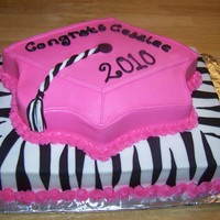 Zebra Graduation 1/2 sheet bottom layer, Wilton grad cap top layer. BC icing and fondant zebra stripes and tassle.