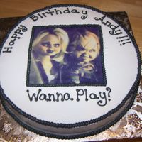 Chucky And Chucky's Bride Believe it or not this cake was for a three year old. Chucky is his favorite. I was afraid I would have nightmares after doing this cake....