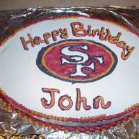 49Er Cake Strawberry cake / BC icing. Made for my little brother's 14th B-day. Loves the niners. We teased him alot for wanting a "pink&...