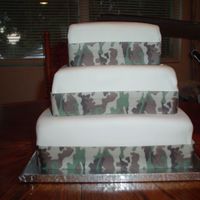 Camo Wedding Cake My very first cake to cover in fondant. The mistakes I made were many many! But I had so much fun and the bride and groom loved it. The...
