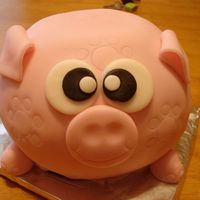 Piggy! From Carol Deacon's book: Party Cakes. It was supposed to be a piggy bank but since it was only practice I didn't go out and buy...