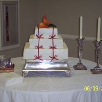 My First Wedding Cake! This was for my nephew's wedding. Gosh, they're a lot of work! Flower is real.