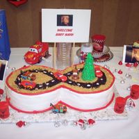 Cars/race Track Baby Shower Cake This was for my cousin's baby shower. He saw a picture of a cake I had done before (with LOTS of inspiration from here) and wanted it...