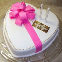 Heart Birthday Cake This was covered with fondant, and the bow was fondant as well. Helen loved it!!