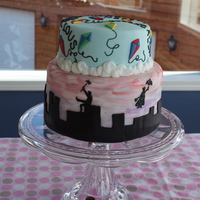 Mary Poppins Birthday Cake used wilton tip #1 to freehand the silhouettes of Mary and Bert while looking at a picture online! Painted the MMF with rum/food coloring...