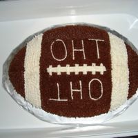 Oak Harbor Tavern Football my first cake. this is before any class was taken. Yellow cake with chocolate and vanilla icing (not buttercream icing).