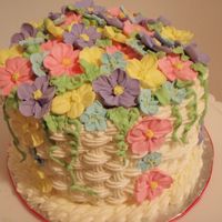 Floral Basketweave Cake Wilton course 2 finale. 6", BC, covered in RI flowers. This pic is on my desk at work, and I get loads of compliments for it.