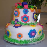 Baby Shower 1 Yellow butter cake w/ orange buttercream, covered in fondant. Bow is put together with tinted white chocolate. My first fondant cake!!!!!