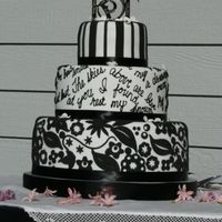 Ry & T Got Married!! My oldest son got married, and my new DIL , well, she's kind of a big deal ;) Fondant covered in white, fondant cutouts and royal...