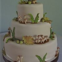 Woodland Cake Tried to recreate the magical marzipan forest cake for a friends wedding. All decorations made from gumpaste. Fondant covered cake barely...