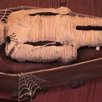 Mummys Coffin Made for DH's work. Modeling chocolate box, fondant covered mummy cake and sugar veil webs