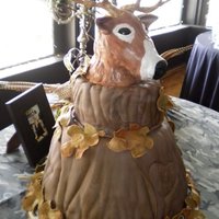 Deer Head Grooms cake I did 2 weeks ago first one that I carved out of RKT Tree trunk cakes with fondant leaves