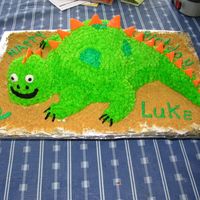 Dinosaur Cake I made this for my son's 2nd birthday. I used buttercream frosting and fondat to make the spikes.