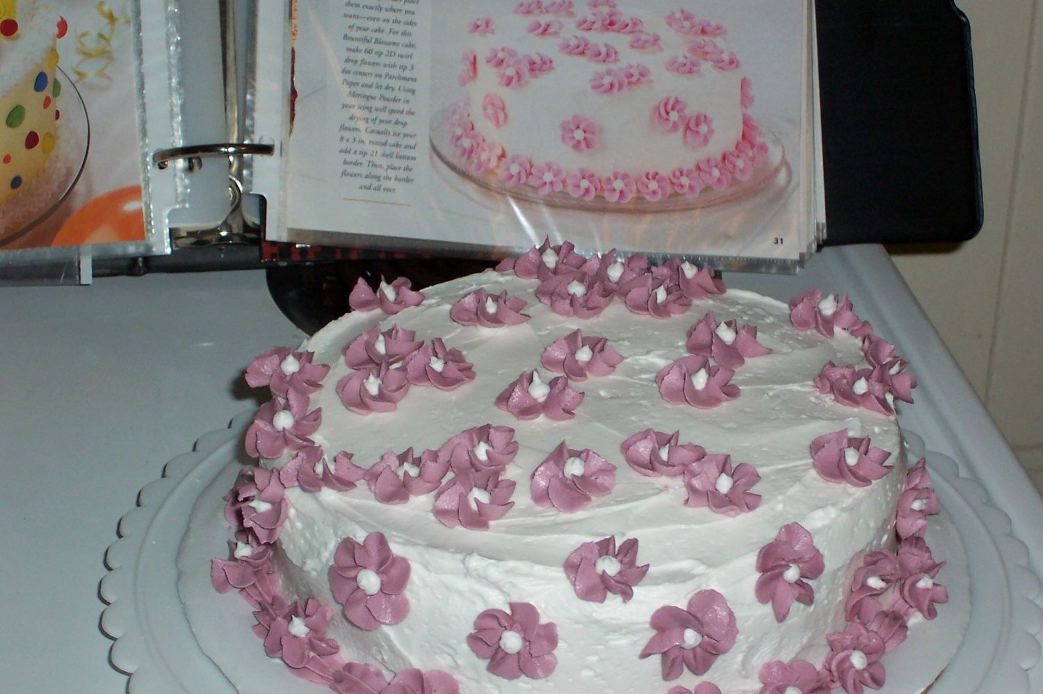 Course I Cake I made these swirl flowers (with buttercream) on parchment paper and then placed them on the cake. I brought this to our family Easter...