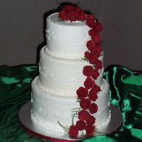 Wedding Cake With Red Roses My first wedding cake! Buttercream with gumpaste roses.