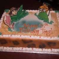 Safari Cake chocolate cake with buttercream, chocolate transfer animals, airbrushed leopard print on sides