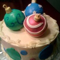Ornament Cake 10" WASC with buttercream. Ornaments are mini ball pan halves stuck together and iced with BC. Covered in fondant, with sanding sugar...