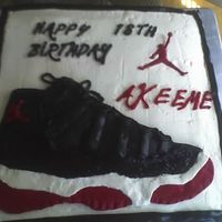 Air Jordan Cake This is my second cake. Jordan shoe, buttercream, chocolate frosting that was dyed black, butter yellow cake.