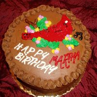 Cardinal Cake This is my third cake. The customer wanted a cardinal on her cake with chocolate cake because she likes song birds and chocolate frosting...