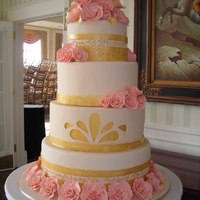 Charity Gala I was asked to make this cake for a charity event to raise money for women with cancer. It has gold detailing with over 50 peach fondant...