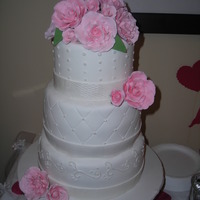 V-Day Wedding Cake W/ Gumpaste Roses White three tier wedding cake covered in fondant with BC piping and pink gumpaste roses. My first attempt at making roses... I was very...