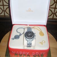 Omega Speedmaster Co-Axial Chronometer single recipe chocolate fudge cake with white chocolate cream cheese frosting. ordered for a guy's 30th birthday by his younger sister...